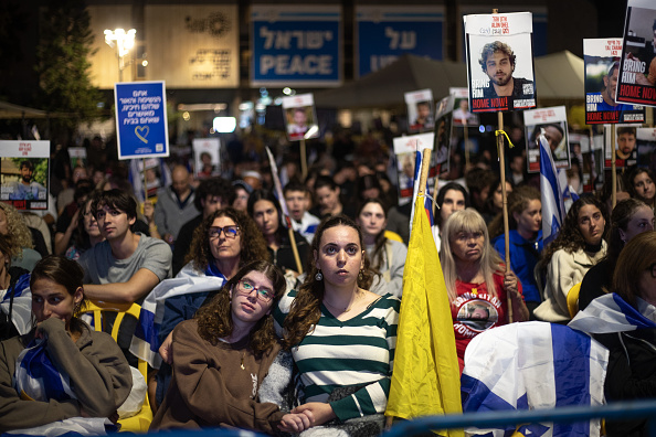 Hamas begins handing over Israeli hostages