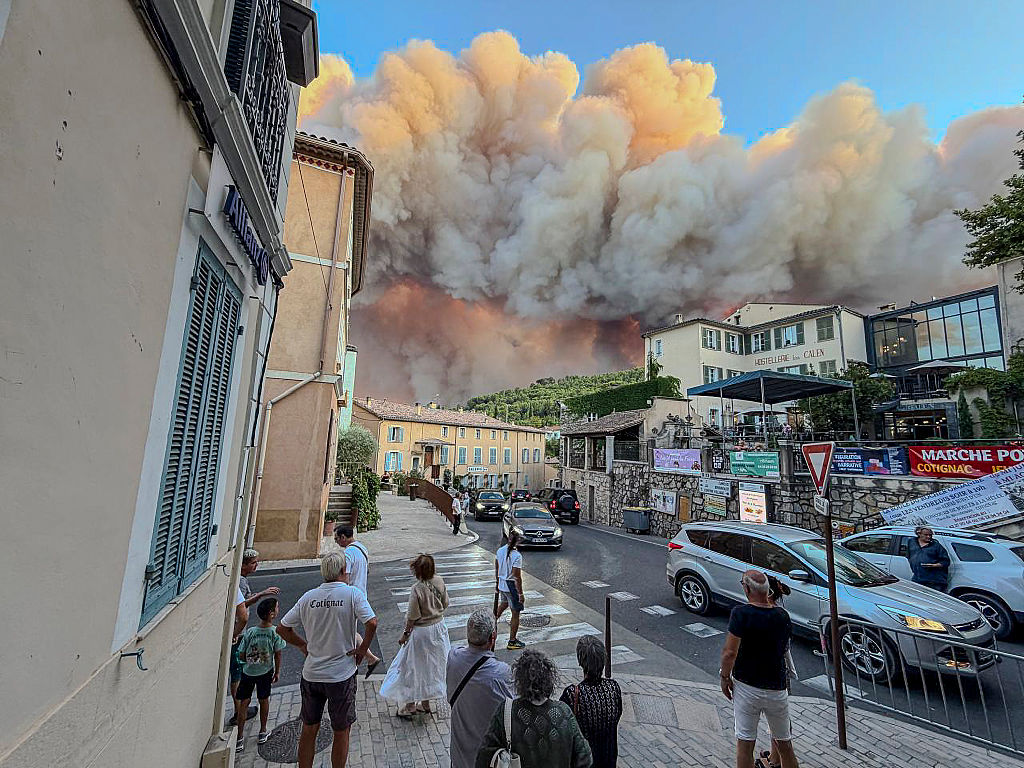 Over 100,000 flee or hole up indoors as wildfires rage in France and Spain