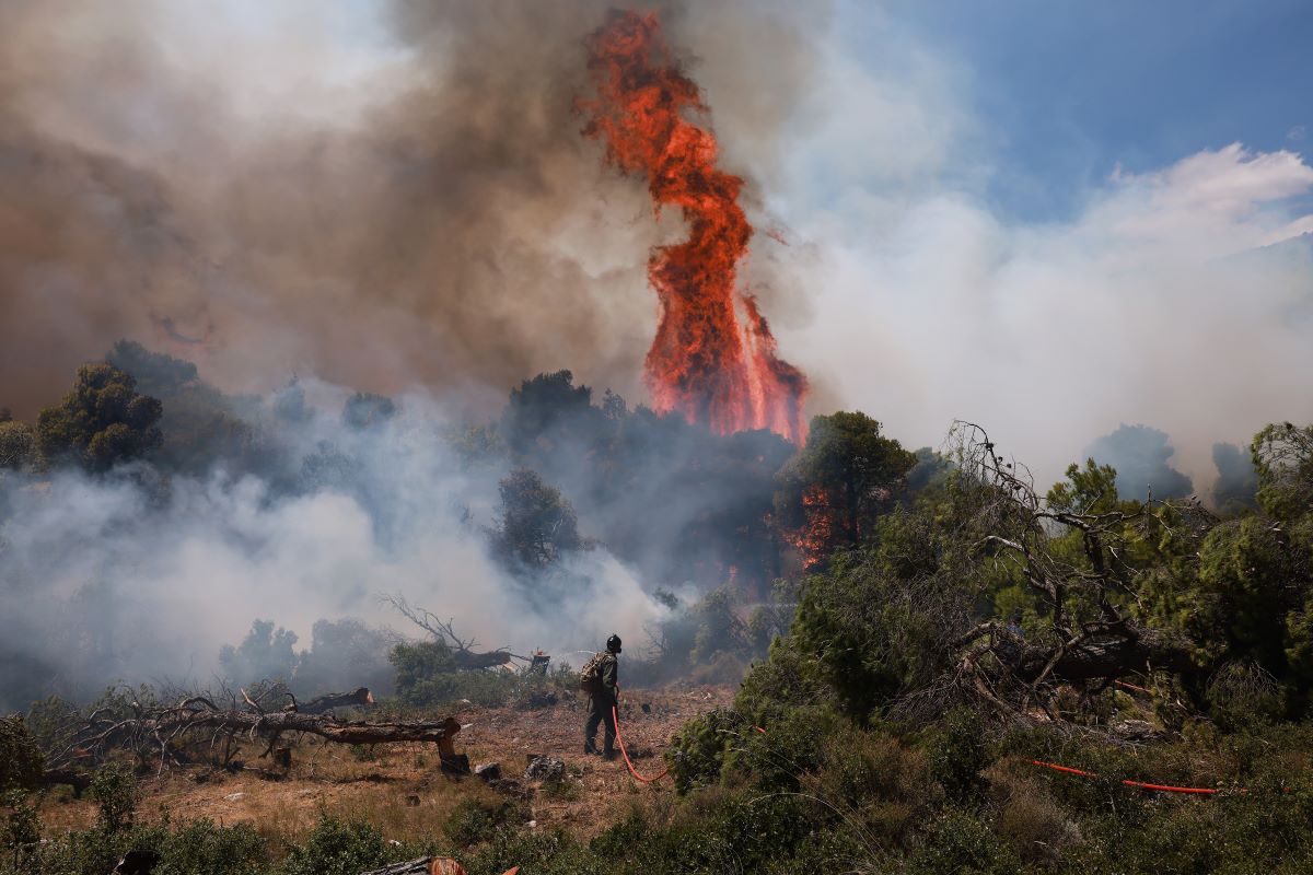 Parched landscape under a hazy sky, symbolizing high fire risk